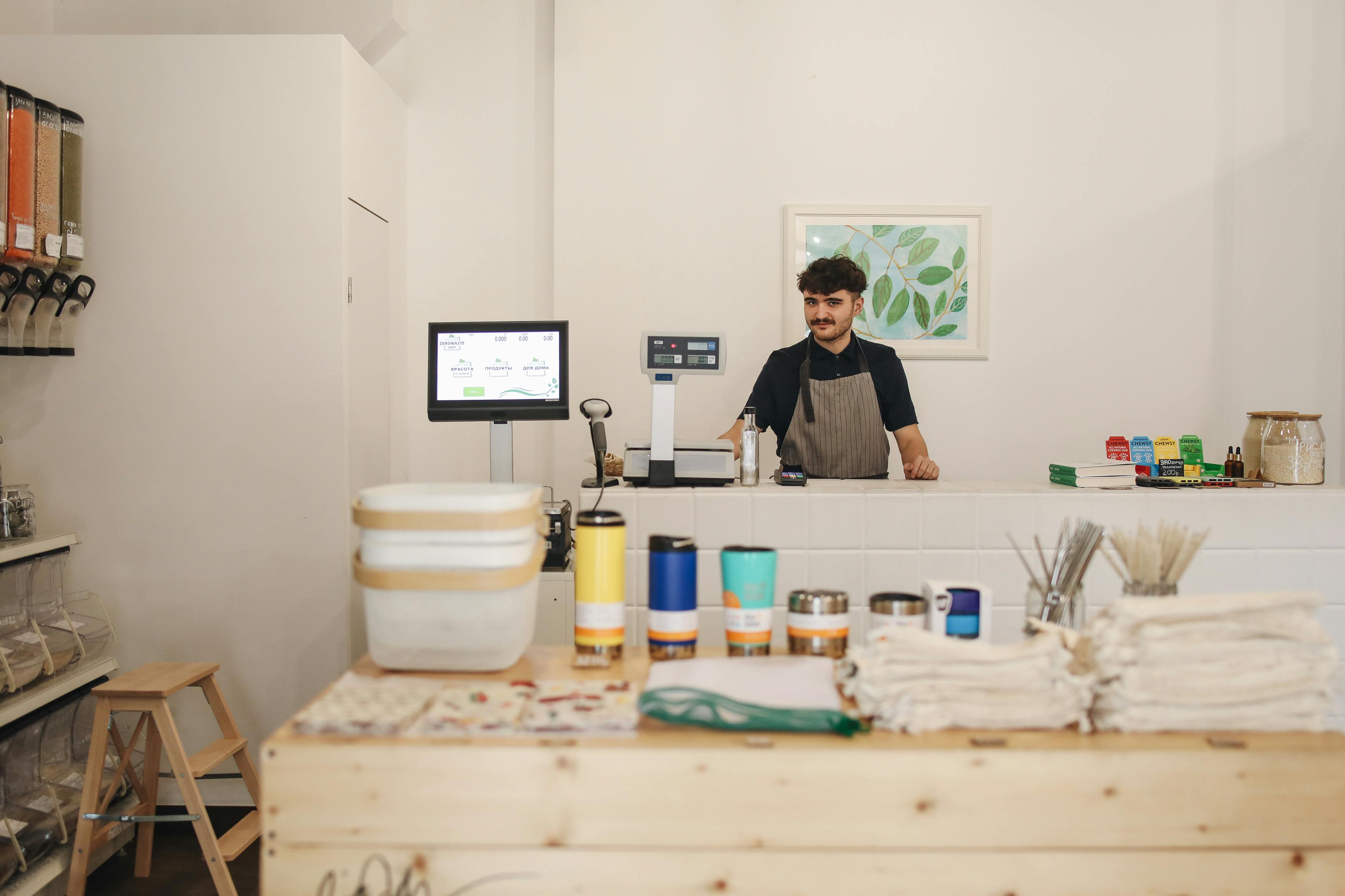 Business owner at storefront counter